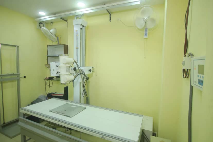 The X-ray room at Caspian Healthcare, with the machine over the table