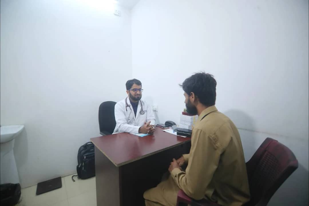 A doctor with a patient in a consultation room at Caspian Healthcare, Vijay Nagar Colony