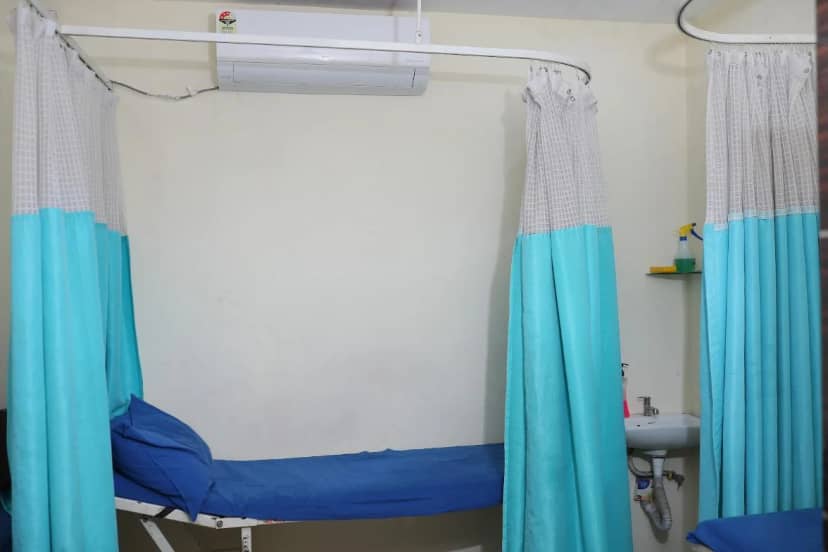 Day care beds behind curtains at Caspian Healthcare