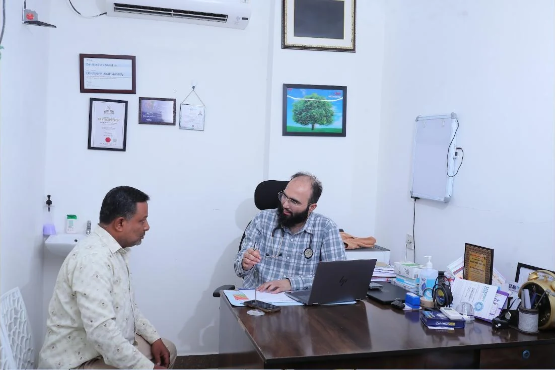 Dr. Khizer Hussain Junaidy with a patient in his consulting room at Caspian Healthcare, Vijay Nagar Colony