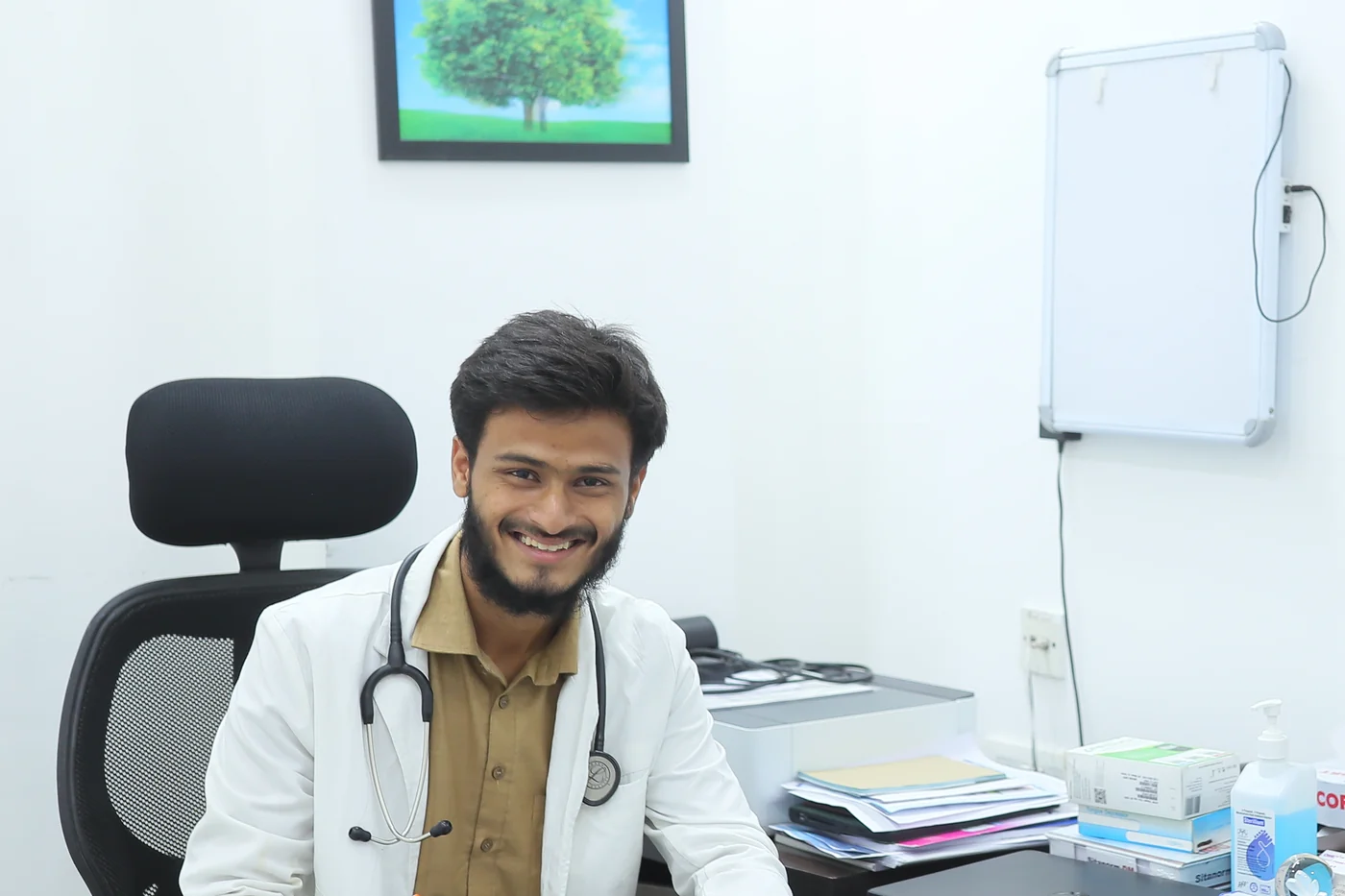The duty doctor at his desk in the outpatient room at Caspian Healthcare, Vijay Nagar Colony, Hyderabad
