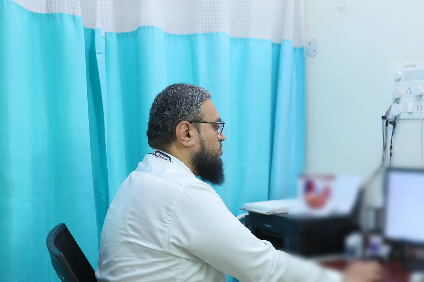 Dr Sayyed Muzammil AK at his desk in the cardiology room at Caspian Healthcare, Vijay Nagar Colony, Hyderabad